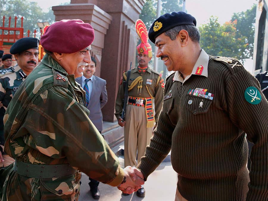 Pakistan Army DGMO Maj Gen Aamer Riaz and Indian Army DGMO Lt Gen Vinodh Bhatia before the delegation level meeting at the Wagah-Attari border.