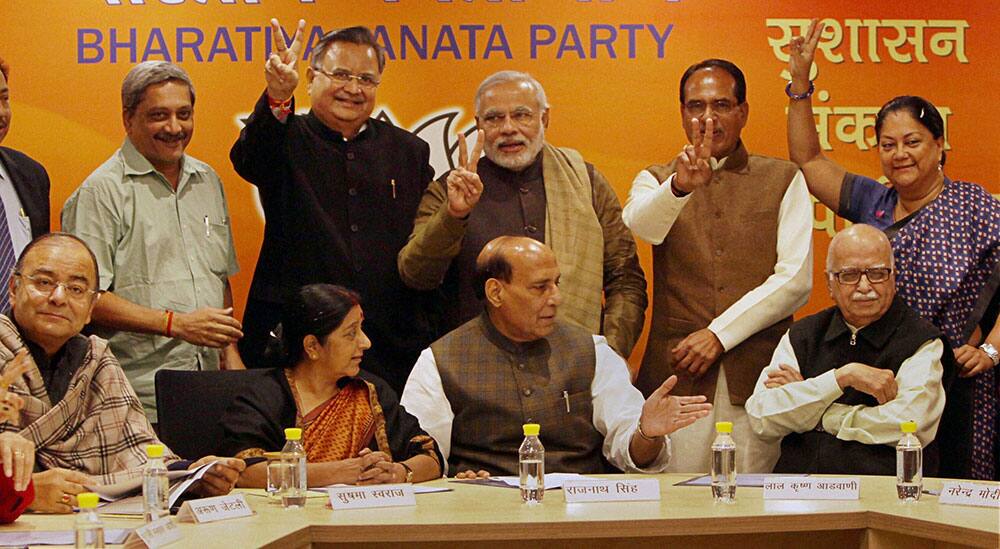 BJP President Rajnath Singh, senior leaders LK Advani, Sushma Swaraj, Arun Jaitley with BJP Chief Ministers Narendra Modi (Gujarat), Shivraj Singh Chouhan (Madhya Pradesh), Vasundhara Raje (Rajasthan), Raman Singh (Chattisgarh), Manohar Parrikar (Goa) during BJP Chief Minister`s conference at party office in New Delhi.