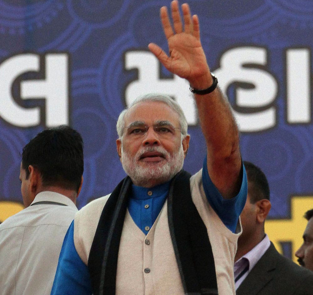 Gujarat state Chief Minister Narendra Modi waves to the audience during the closing ceremony of Khel Mahakumbh, or Sports Event in Ahmadabad.