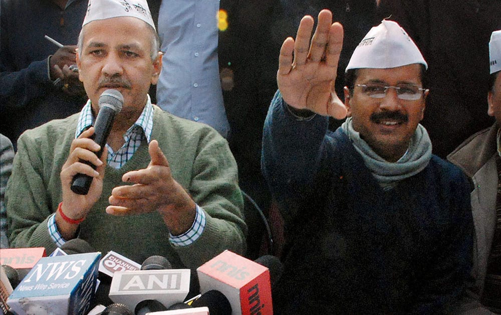 AAP Convener Arvind Kejriwal with party leader Manish Sisodiya addressing the media after a party meeting at Kaushambi in Ghaziabad.