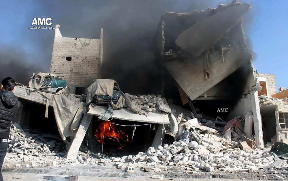 This citizen journalism image provided by Aleppo Media Center, AMC, which has been authenticated based on its contents and other AP reporting, shows a destroyed building after a Syrian aircraft pummeled masaken hanano, an opposition neighborhood in the northern city of Aleppo, Syria.