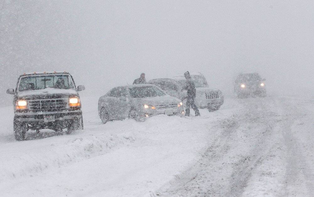 Cars are seen off the side of the road that evidently spun out on I-43 northbound at N. Port Washington Rd. near Port Washington, Wis.