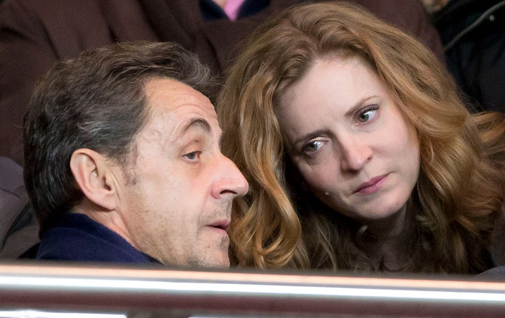 Former French President Nicolas Sarkozy, left, and Nathalie Kosciusko-Morizet, candidate for the upcoming election for the mayor of Paris talk together prior to a French league one soccer match between Paris-Saint-Germain and Lille at Parc des Princes stadium in Paris.
