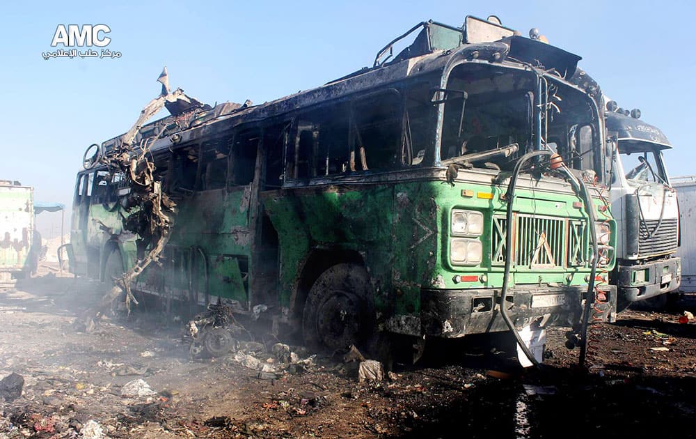 This citizen journalism image provided by Aleppo Media Center, AMC, which has been authenticated based on its contents and other AP reporting, shows damages of a burned bus after a Syrian aircraft pummeled masaken hanano, an opposition neighborhood in the northern city of Aleppo, Syria.