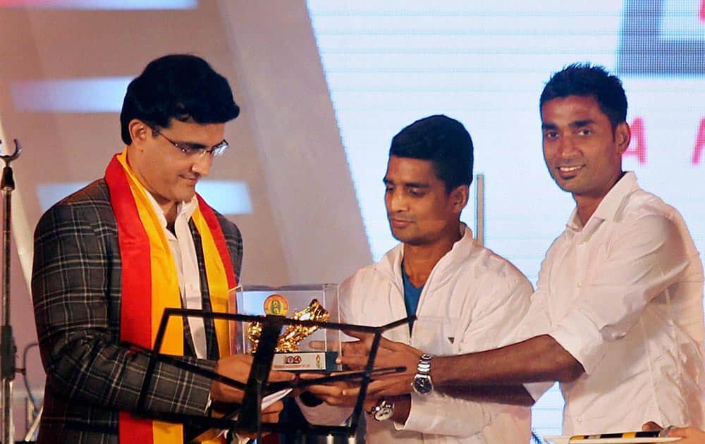 Former cricketer Sourav Ganguly felicitated by the East Bengal team members during the pre-centenary celebrations of East Bengal club at Salt Lake stadium in Kolkata.