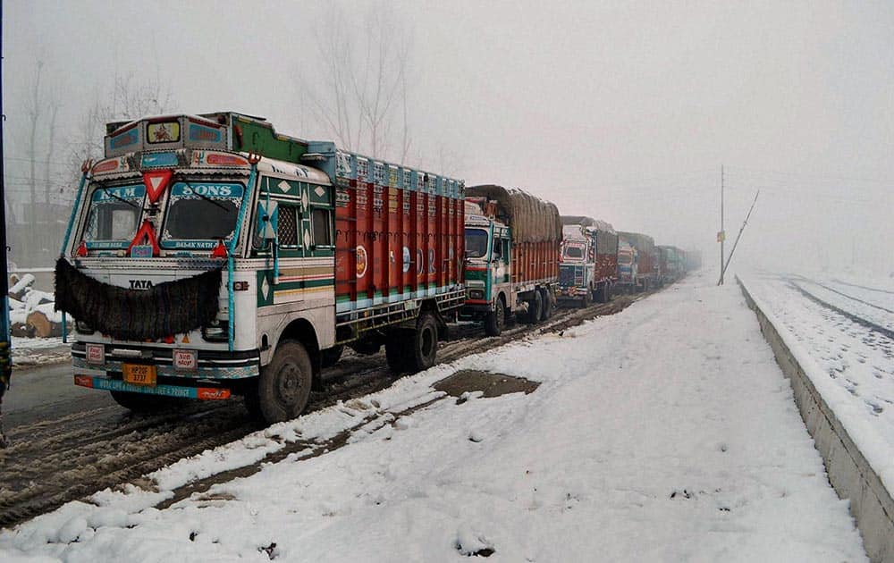 A queue of stranded trucks on the Srinagar-Jammu National Highway, which was closed for vehicular traffic due to heavy snowfall in Qazigund, 69 kms from Srinagar.