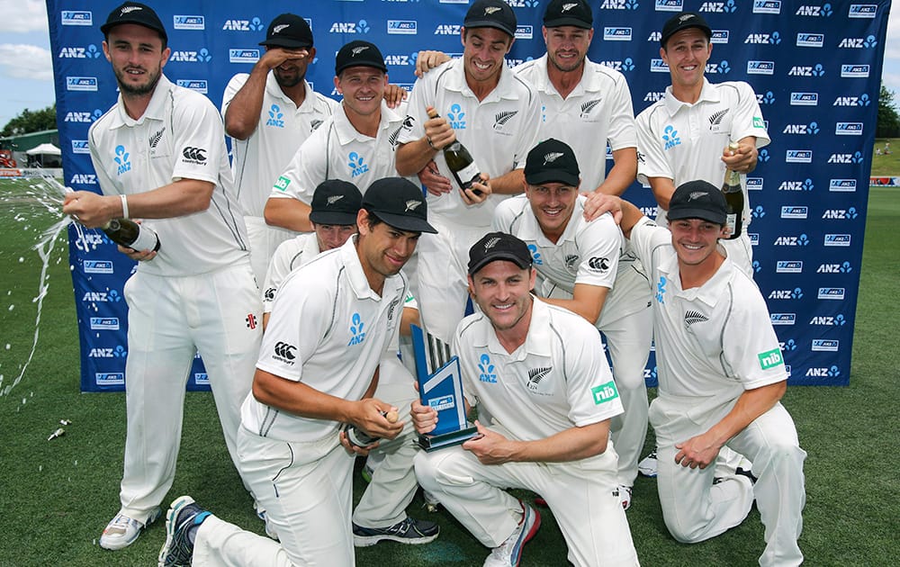 New Zealand celebrate their series win over the West Indies in the third cricket test, at Seddon Park, in Hamilton, New Zealand.