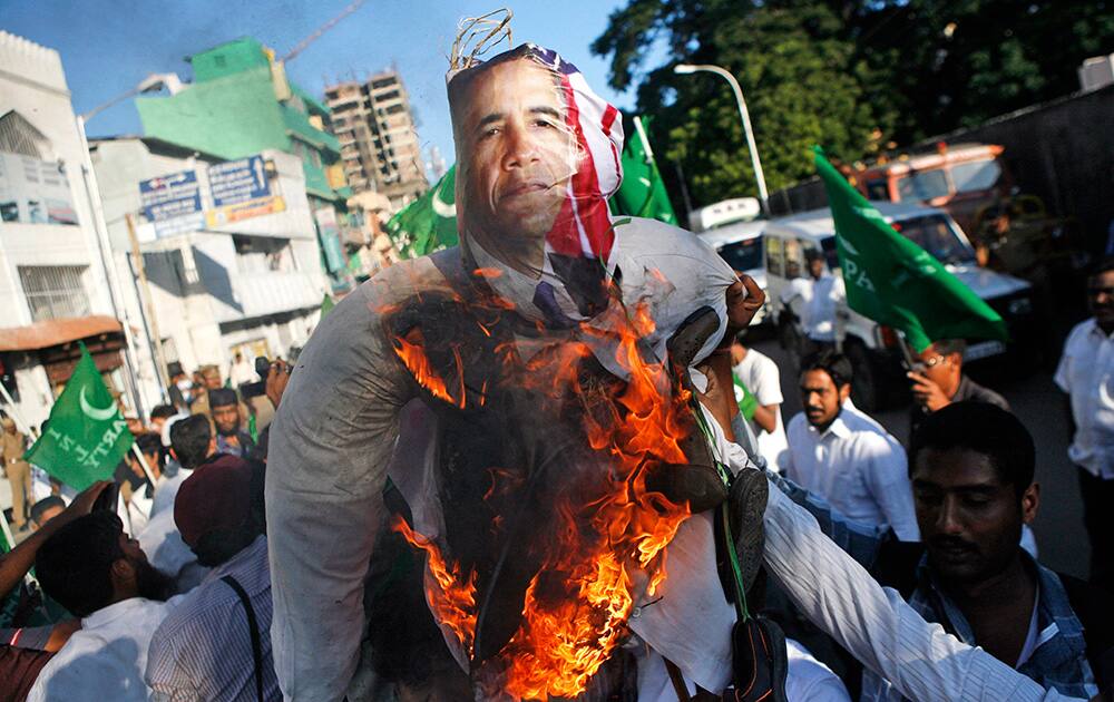 Muslim activists burn an effigy of US President Barack Obama during a protest outside the US consulate in Chennai, India.