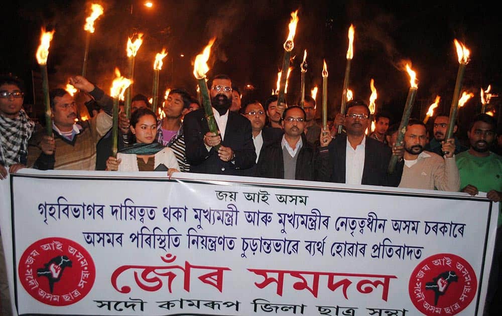 Members of All Assam Students’ Union (AASU) taking out a candle light procession against the state government’s alleged failure to maintain the law and order situation in Guwahati.