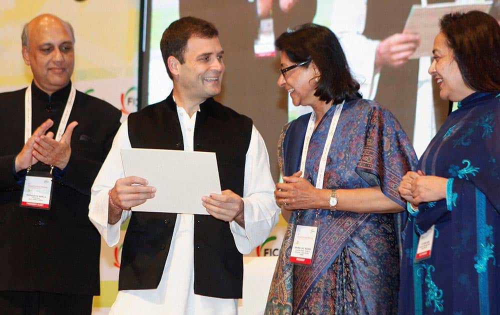 Congress Vice President Rahul Gandhi with FICCI President Naina Lal Kidwai (2nd R) and President-elect Sidharth Birla (L) at 86th Annual General Meeting of FICCI in New Delhi.