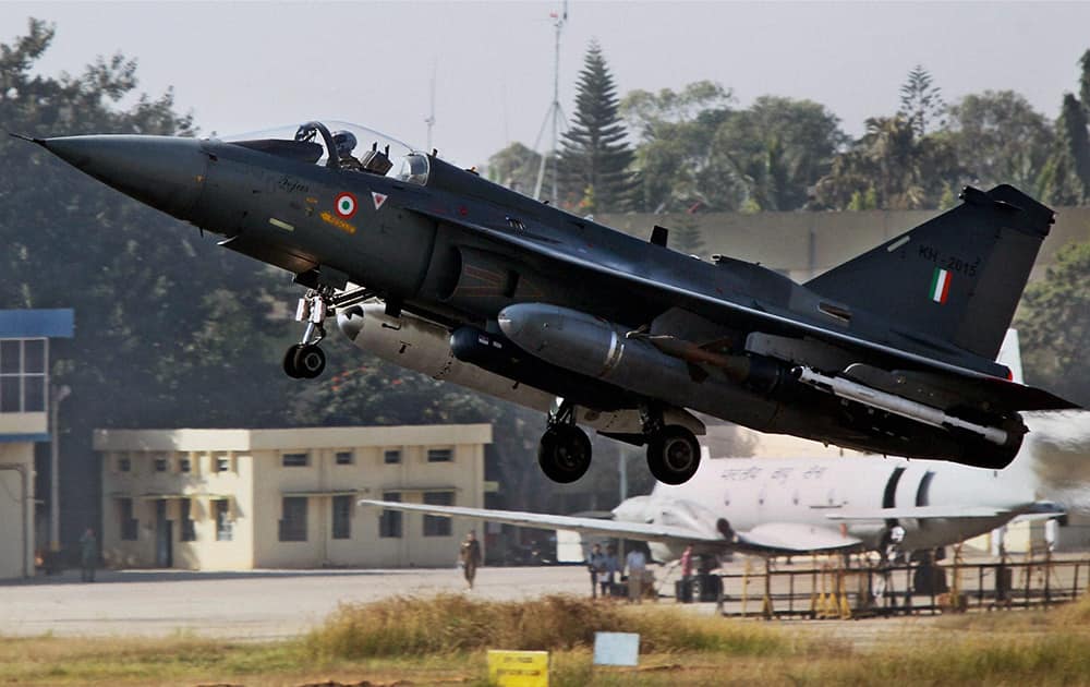 The Light Combat Aircraft, Tejas, takes off during its initial operational clearance for induction into the IAF, in Bengaluru. LCA Tejas received Initial Operational Clearance for Induction into Indian Air Force.