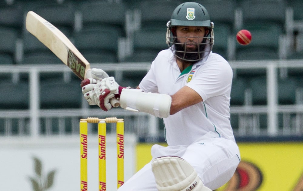 Hashim Amla avoids a bouncer from India`s bowler Mohammad Shami during the second day of their cricket test match at Wanderers stadium in Johannesburg, South Africa.