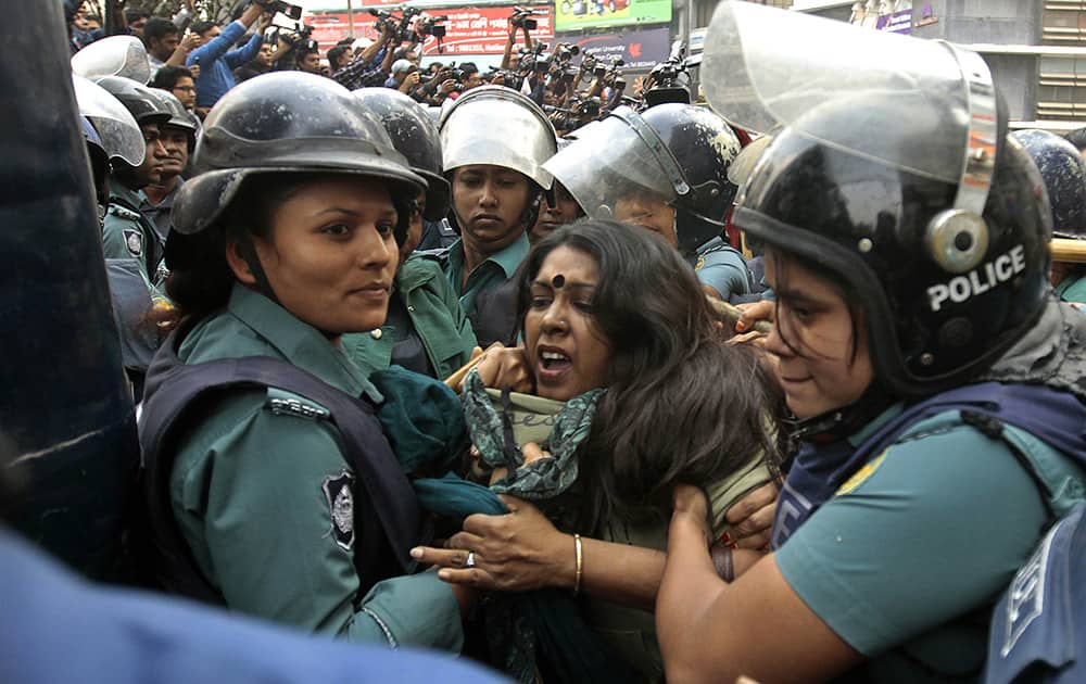 Bangladeshi police detain activists who tried marching towards the Pakistani Embassy in Dhaka, Bangladesh.