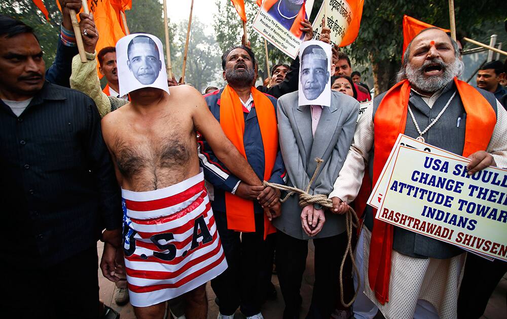 Supporters of Shivsena walk with people representing US President Barack Obama near the US Embassy to protest against the alleged mistreatment of New York based Indian diplomat Devyani Khobragade, in New Delhi.