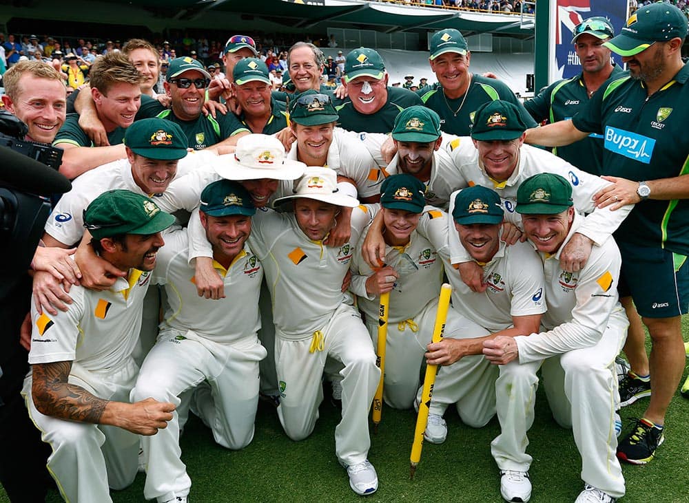 The Australian team poses for group photo after winning their Ashes cricket test match over England, in Perth, Australia. Australia won the match by runs and take an unbeatable 3-0 lead in the five game series.
