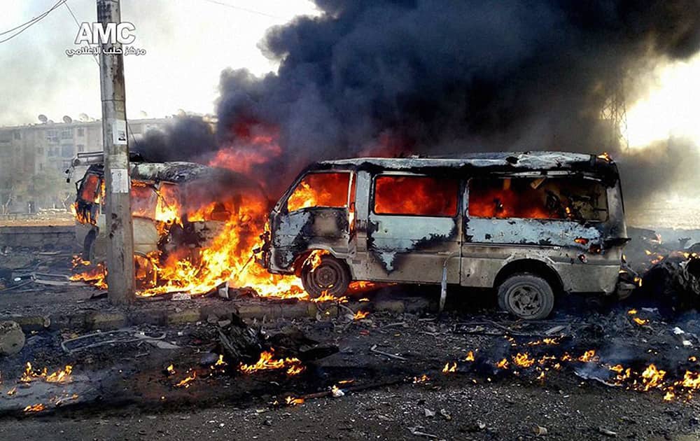 CITIZEN JOURNALISM IMAGE PROVIDED BY ALEPPO MEDIA CENTER AMC, WHICH HAS BEEN AUTHENTICATED BASED ON ITS CONTENTS AND OTHER AP REPORTING, SHOWS FLAMES RISING FROM BURNING VEHICLES FOLLOWING A SYRIAN GOVERNMENT AIRSTRIKE IN ALEPPO, SYRIA.