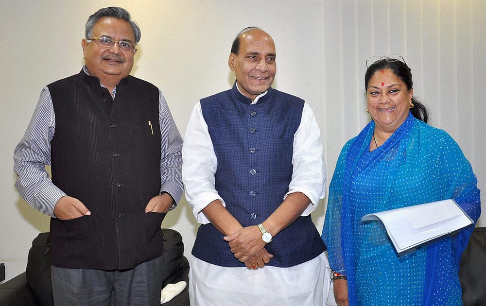 BJP NATIONAL PRESIDENT RAJNATH SINGH WITH CHHATTISGARH CHIEF MINISTER RAMAN SINGH AND RAJASTHAN CHIEF MINISTER VASUNDHRA RAJE AT A MEETING IN NEW DELHI.
