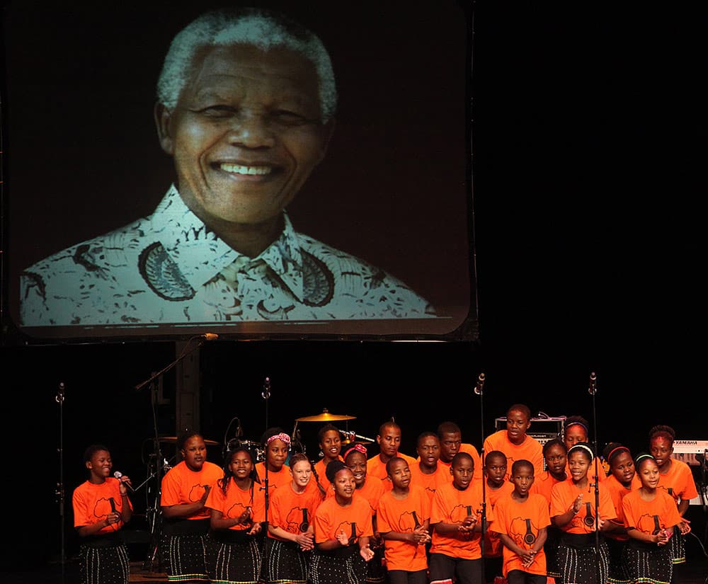 Key of Hope Choir-Durban South Africa perform during a tribute to the late Nelson Mandela Sunday Dec. 15, 2013 at Music Hall in Detroit.