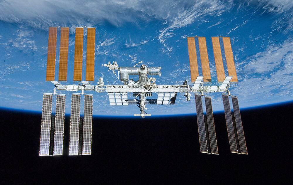 In this image provided by NASA the International Space Station is shown with the backdrop of Earth. The image was photographed by an STS-132 crew member on space shuttle Atlantis after the station and shuttle began their post-undocking relative separation on May 23, 2010.