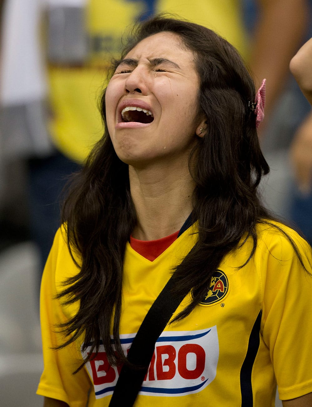 A fan of America cries at the end of the match against Leon during the final of the Mexican soccer league championship in Mexico City.