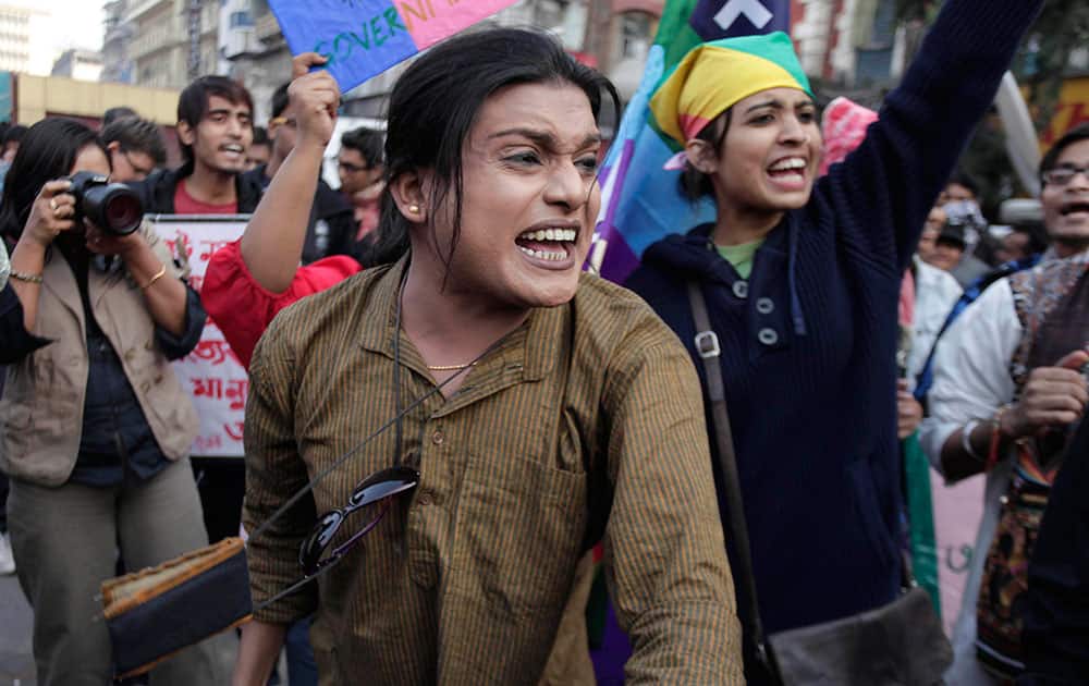 Indian gay rights activists shout slogans as they protest Supreme Court`s ruling criminalizing gay sex in Kolkata.