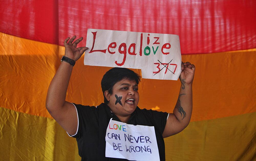 An Indian gay rights activist holds a placard during a protest against a Supreme Court verdict that upheld section 377 of the Indian Penal Code that criminalizes homosexuality in Hyderabad.