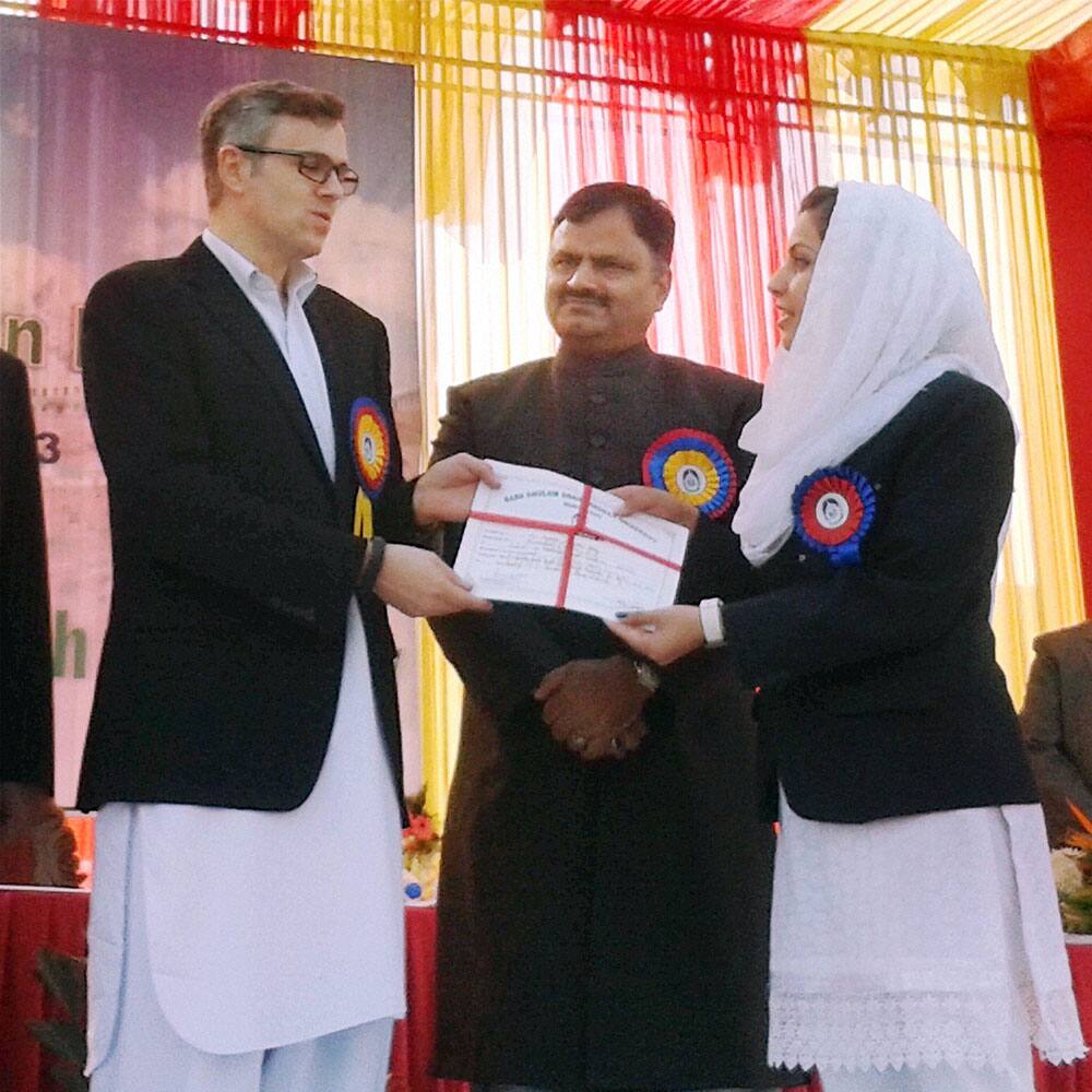 Jammu and Kashmir Chief Minister Omar Abdullah felicitates a student on 10th Foundation Day of Baba Ghulam Shah Badshah University in Rajouri.