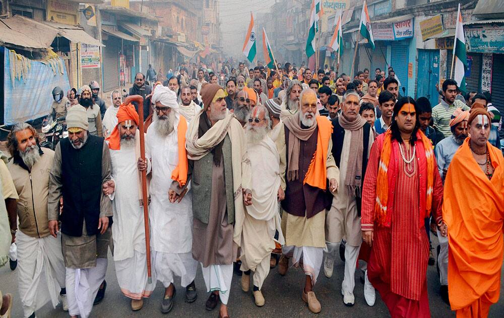 Saints and religious activists participate in Run for Unity event organised on the death anniversary of Sardar Vallabh Bhai Patel in Ayodhya.