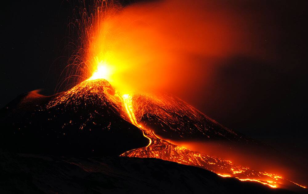 Mt. Etna, Europe`s tallest and most active volcano, spews lava during an eruption near the Sicilian town of Catania, Italy.
