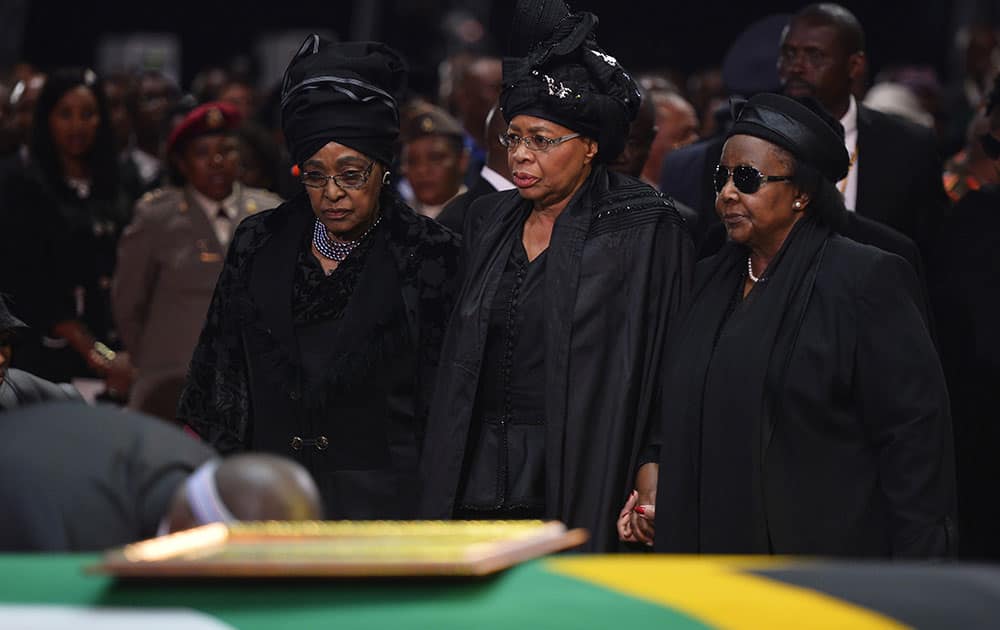 Winnie Madikizela-Mandela, left, Nelson Mandela`s former wife, left and Nelson Mandela’s widow Graca Machel arrive for the former South African president`s funeral service in Qunu, South Africa.