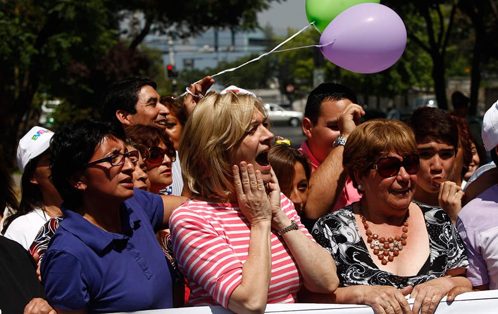 Presidential candidate Evelyn Matthei gestures during a rally outside her home in Santiago. Next Sunday, Matthei will face Michelle Bachelet, who became Chile`s first female president from 2006 to 2010.