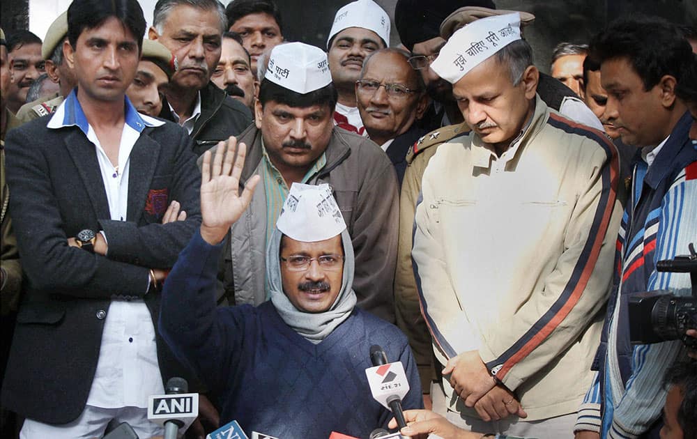 Aam Aadmi Party convenor Arvind Kejriwal with party leaders addresses the media after a meeting with Lt Governor Najeeb Jung in New Delhi.