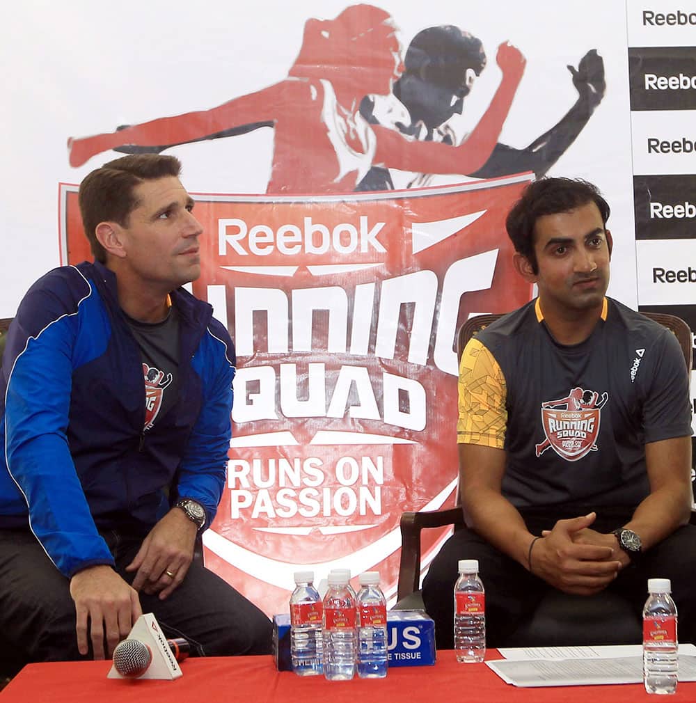 Cricketer Gautam Gambhir and Eric Haskell, MD, Adidas Group in India, interact with media during an event ahead of the Delhi Half Marathon, in New Delhi.