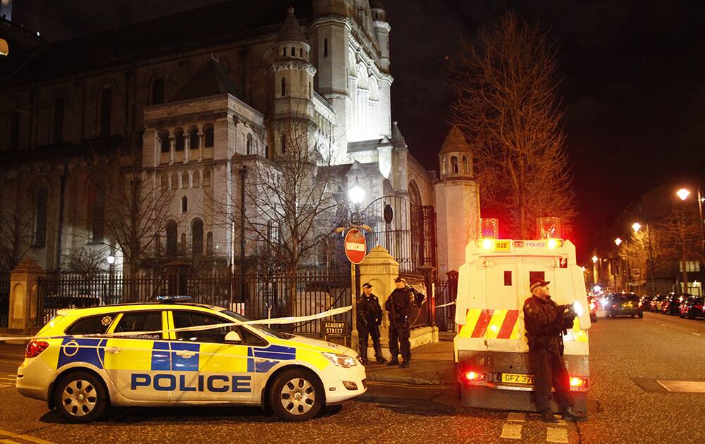 Police officers secure the area close to the scene of a small explosion in the Cathedral Quarter in Belfast city centre, Northern Ireland.