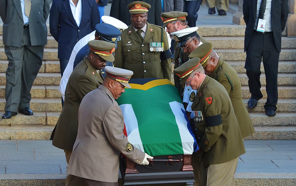 The national flag draped coffin of former South African President Nelson Mandela is carried down steps of the Union Buildings at the end of the third and final day of lying in state in Pretoria, South Africa.
