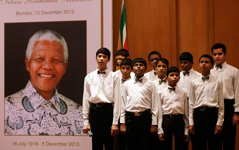 Visually impaired children of the Happy Home School sing a song during a memorial service for late former South African President Nelson Mandela in Mumbai.