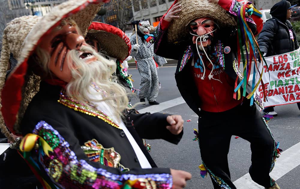 Costumed dancers participate in the final leg of the Carrera Antorcha Guadalupana or Our Lady of Guadalupe Torch Run, in New York.
