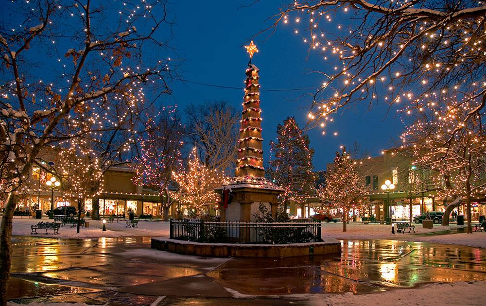 This undated image provided by New Mexico Tourism shows the historic plaza in Santa Fe, N.M., lit up for Christmas. A blend of Spanish, Anglo and Native traditions mark the holiday season in New Mexico.