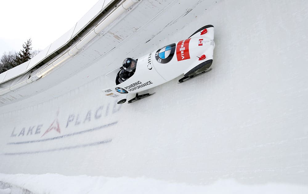 Canada`s Lyndon Rush pilots with brakeman Lascelles Brown during a training run for the two-man bobsled World Cup competition, in Lake Placid, N.Y.