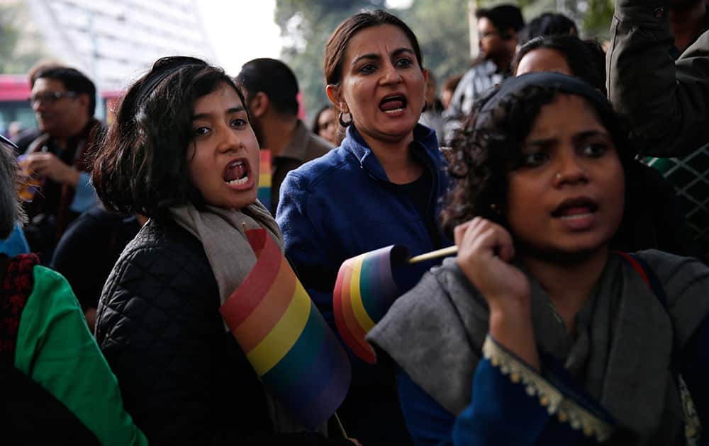 Gay rights activists shout slogans at a protest meeting after the top Indian court ruled that a colonial-era law criminalizing homosexuality will remain in effect in India in New Delhi.