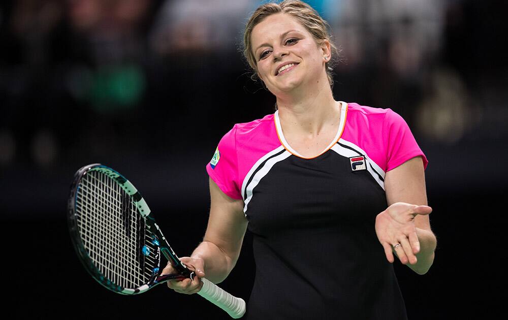 Belgium`s Kim Clijsters reacts during an exhibition doubles tennis match against Belgium`s Kirsten Flipkens and France`s Henri Leconte at the Sportpaleis in Antwerp.