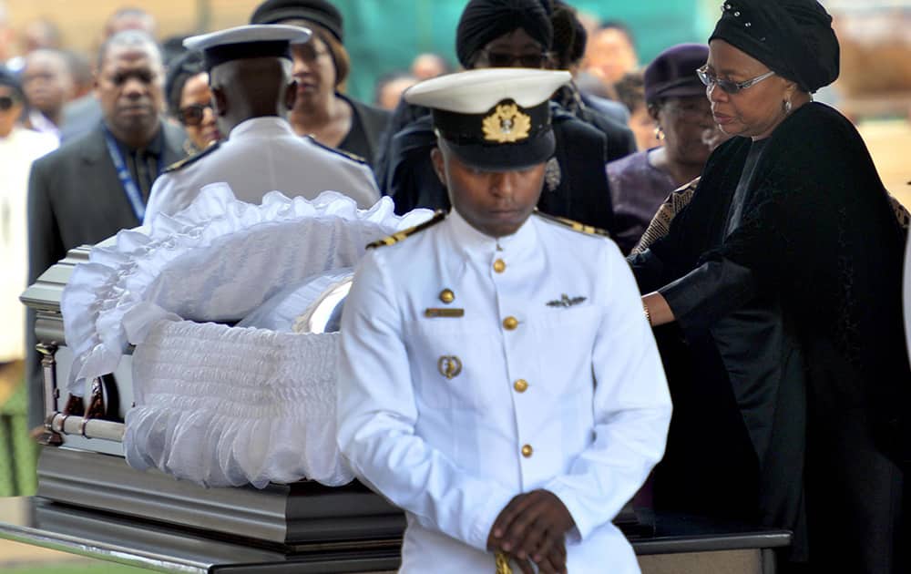 Nelson Mandela`s widow Graca Machel pays her respects to former South African President Nelson Mandela during the lying in state at the Union Buildings in Pretoria, South Africa.