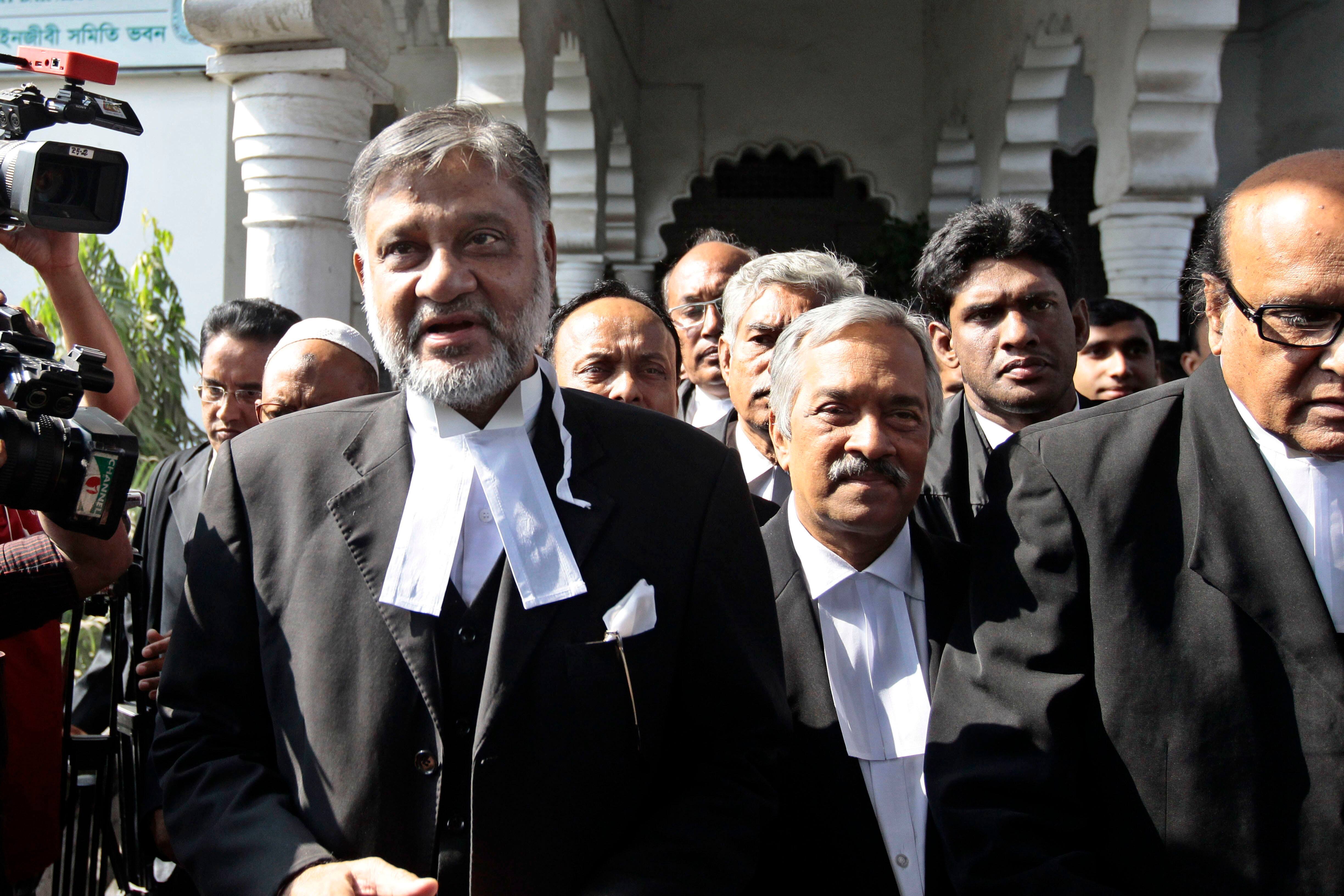 Abdur Razzak, left, lawyer of Islamist opposition leader Abdul Quader Mollah, talks to the media outside a court in Dhaka, Bangladesh. Mollah, convicted of war crimes during the nation`s war of independence against Pakistan in 1971, was due to be executed at 00:01 Wednesday, but lawyers went to the home of Judge Syed Mahmud Hossain and secured a postponement.
