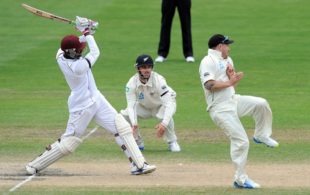 New Zealand`s Brendon McCullum, right, reacts after a shot from West Indies` Shane Shillingford on the fifth day of the International cricket match, at the University Oval, in Dunedin, New Zealand.