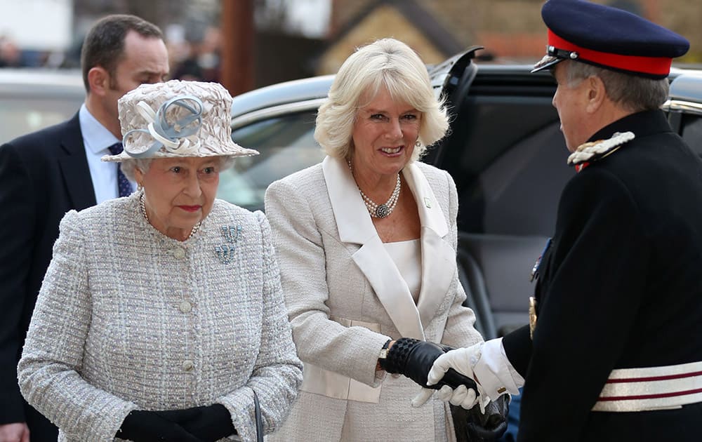 Britain`s Queen Elizabeth II and The Duchess of Cornwall arrive to open the new Barnardo`s children`s charity head quarters in Ilford, east London.