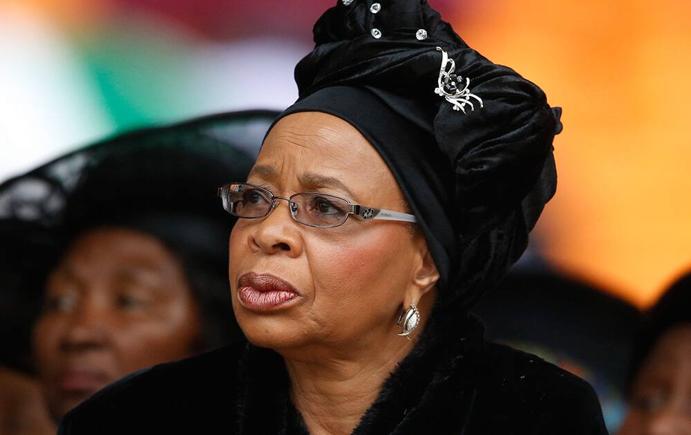 Nelson Mandela`s widow Graca Machel listens to speakers during the memorial service for former South African president Nelson Mandela at the FNB Stadium in Soweto near Johannesburg.