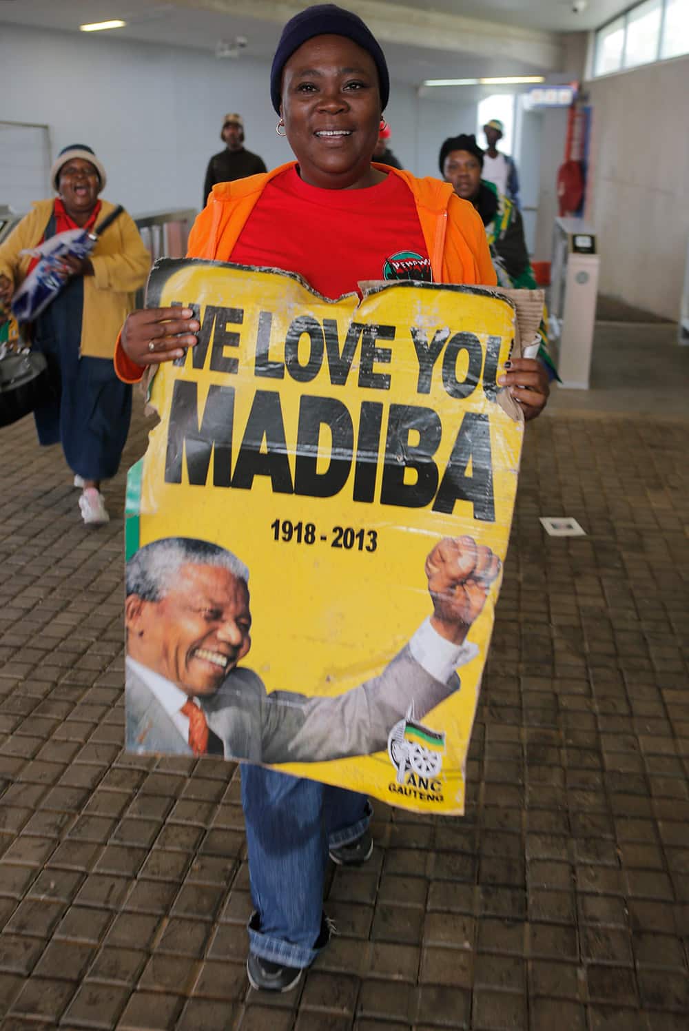 People arrive for the memorial service for former South African president Nelson Mandela at the FNB Stadium in Soweto, near Johannesburg.