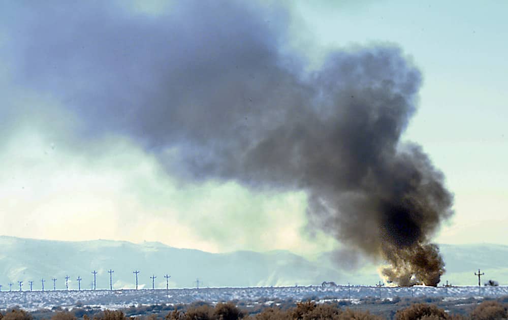 Smoke from the Bango Refining oil plant explosion can be seen along U.S. 50 alternate between Fernley and Fallon. Monday`s fire critically injured a 24-year-old refinery worker.