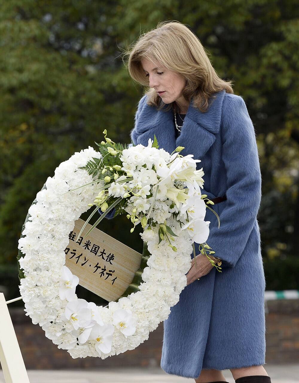 Caroline Kennedy, U.S. ambassador to Japan, offers a wreath in front of the Statue of Peace at Nagasaki Peace Park in Nagasaki, southern Japan.