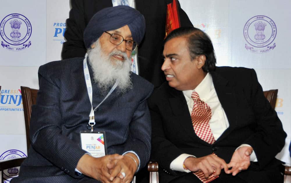 Punjab Chief Minister Parkash Singh Badal and Reliance Industries Chairman Mukesh Ambani during the Progressive Punjab Investors Summit 2013 in Mohali.